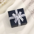 Elegant navy blue square jewelry gift box with decorative white ribbon and bow - Blue