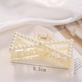 Detail of 9.5cm pearl bow hair claw clip showing size scale on white silk background - S217-5# Bowknot Pearl Claw