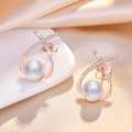 Elegant white pearl earrings with rose gold geometric zircon settings on silk background - Rose Gold Teardrop Pearl Stud Earrings (C141)