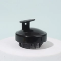 Ergonomic silicone scalp massager brush in solid black finish with hanging handle - Black