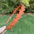 Matte orange floral headband for women featuring an elegant 3D flower pattern design - Orange Red