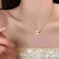 Elegant rose gold titanium D-letter double ring necklace worn on a female model neck - Necklace / Gold Letter D Necklace