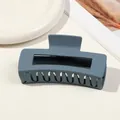 Detailed view of a matte dusty blue large hair claw clip with a hollow rectangular design - 10.5cm Rectangular - Matte Sky Blue