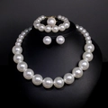 Elegant white pearl jewelry set with necklace bracelet and earrings on a black bust display - 12# Set—Large Pearl 4-Piece