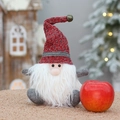 Christmas gnome plush toy with red knitted hat and gold bell sitting next to a red apple - Red Hat Apple Pouch