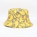 Close-up of yellow cotton bucket hat featuring all-over cartoon duck print detail - One Size / All-over Yellow Duck Print / Yellow