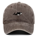 Detailed close-up of orca whale embroidery on vintage washed cotton baseball cap - Orca Embroidery Style / Coffee