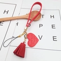Red faux leather heart strap with tassel and gold metal clasp for phone cases - Red