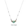 Detailed close-up of green agate bead pendant with golden rings on stainless steel chain - Green Agate-Gold Chain