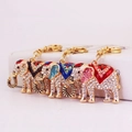 Colorful rhinestone elephant keychains in black, blue, and red with gold-tone metal finish - Random Color