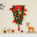 Upside-down Christmas tree hanging with red bows, golden ornaments and berries on wall - Style E Teardrop Swag