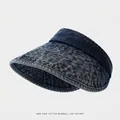 Detail of dark blue denim sun visor for kids featuring quilted stitching and open top - 54cm (4-9 Years Old) / Dark Blue