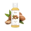 Natural Argan oil in 4oz bottle with fresh Argan nuts and leaves on white background - Argan Oil