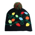 Close-up of black Christmas knit hat with LED lights, colorful bulb pattern, and red-green pompom - One Size / Black String Lights (LED)