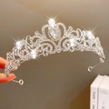 Elegant silver princess crown with teardrop crystal and rhinestone floral details - Silver Teardrop Main Stone