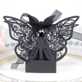 Elegant black butterfly laser-cut favor box with ribbon on a ceramic plate - 4.5CM / Black