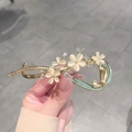 Detail of golden floral hair clip with opal flowers and sparkling rhinestones - Opal Flower Gold Hair Clip