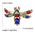 Broche de libélula vintage en oro antiguo con pedrería facetada roja y azul - Oro Antiguo