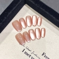Cat eye press-on nails in rose gold shimmer with oval shape on textured display cloth - Extra Small (XS) / 1821-Short Oval