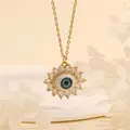 Macro shot of 18K gold plated evil eye pendant with blue enamel and white zircon stones - Blue White Flower-E2