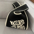 Knitted tote bag with black and white rose pattern and asymmetrical handle design - Retro Rose Black Rice