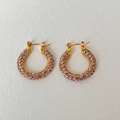 Golden round earrings with pavé set purple crystals and a secure hinged clasp design - Purple