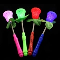 LED Leuchtrose Spielzeugstab mit Federgriff in Pink Grün Rot und Blau Farben - Rose