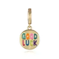 Macro shot of 18k gold plated round pendant with colorful Good Luck enamel lettering - Good Luck