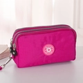 Mini magenta nylon telefoontasje met drie ritsvakken en een ster-logo-patch - Donkerrood Groot