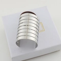 Minimalist silver multi-layered metal cuff bracelet displayed on a white fabric box - Silver Large