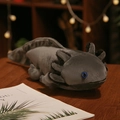 Grey axolotl plush toy with black gills and blue eyes sitting on a wooden desk - Type B (Prone Position) / 45cm / Gray