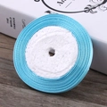 Sky blue 6mm satin ribbon roll with smooth glossy finish on white foam core - Blue