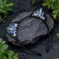 Detail of blue crystal cat ear headband with silver wire wrapping on dark stone - Dark Blue Crackle Cat Ears