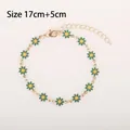 Golden daisy flower bracelet featuring green petals and adjustable lobster clasp closure - Green Daisy (Gold Tone)