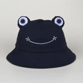 Detail of a black cotton bucket hat featuring 3D frog eyes and white embroidered smile - Adult / Black