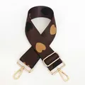 Detail of adjustable nylon bag strap with heart jacquard pattern and gold swivel hooks - No. 9 + Gold Hook (Coffee with Earthy Yellow/Black Heart)