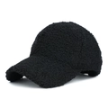 Close-up of fluffy black teddy fleece baseball cap showing warm textured lamb wool fabric - Black