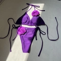 Purple glossy bikini set featuring 3D fabric rose flowers and side tie bikini bottoms - Purple
