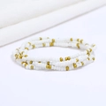 Detail of four-layered elastic beaded bracelet with white and gold seed beads on fabric - #35(White Gold Beads)
