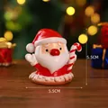 Miniature resin Santa Claus figurine holding a candy cane, Christmas desk decor - Santa Claus