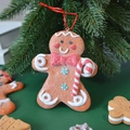 Gingerbread man Christmas tree ornament with red bow and candy cane on green branch - Red Bowknot Cane (Height 11cm)