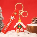 Christmas snowman keychain featuring a red gingerbread house charm and festive wrist strap - Festive Christmas House