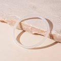 Detailed view of semi-transparent white acrylic bangle resting on a textured stone surface - White Thin Style (9#)