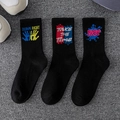 Three-pack black crew socks with street art graffiti prints and ribbed cotton texture - 3 Pairs (Styles 21, 22, 30)