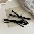 Set of two matte black leopard style 3D bow hair clips with premium leather texture - Black Hair Clip