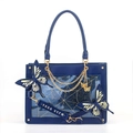 Detail view of dark blue tote bag with gold spider web pattern and butterfly appliques - Navy Blue Butterfly