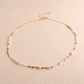 Detail of baroque freshwater pearl necklace with pink beads and gold metal tubes - Seed Pearl Baroque Rhodonite Style
