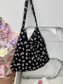 Black canvas tote bag with white bow print and shoulder strap in a lifestyle setting - Black Background White Bow(40#)