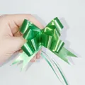 Green pull bow ribbon with gold edges for gift wrapping and festive holiday decorations - Solid Dark Green