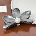 Grey marble texture hair claw clip with a large pearl center on a wooden surface - Grey Flower Claw-11.5cm